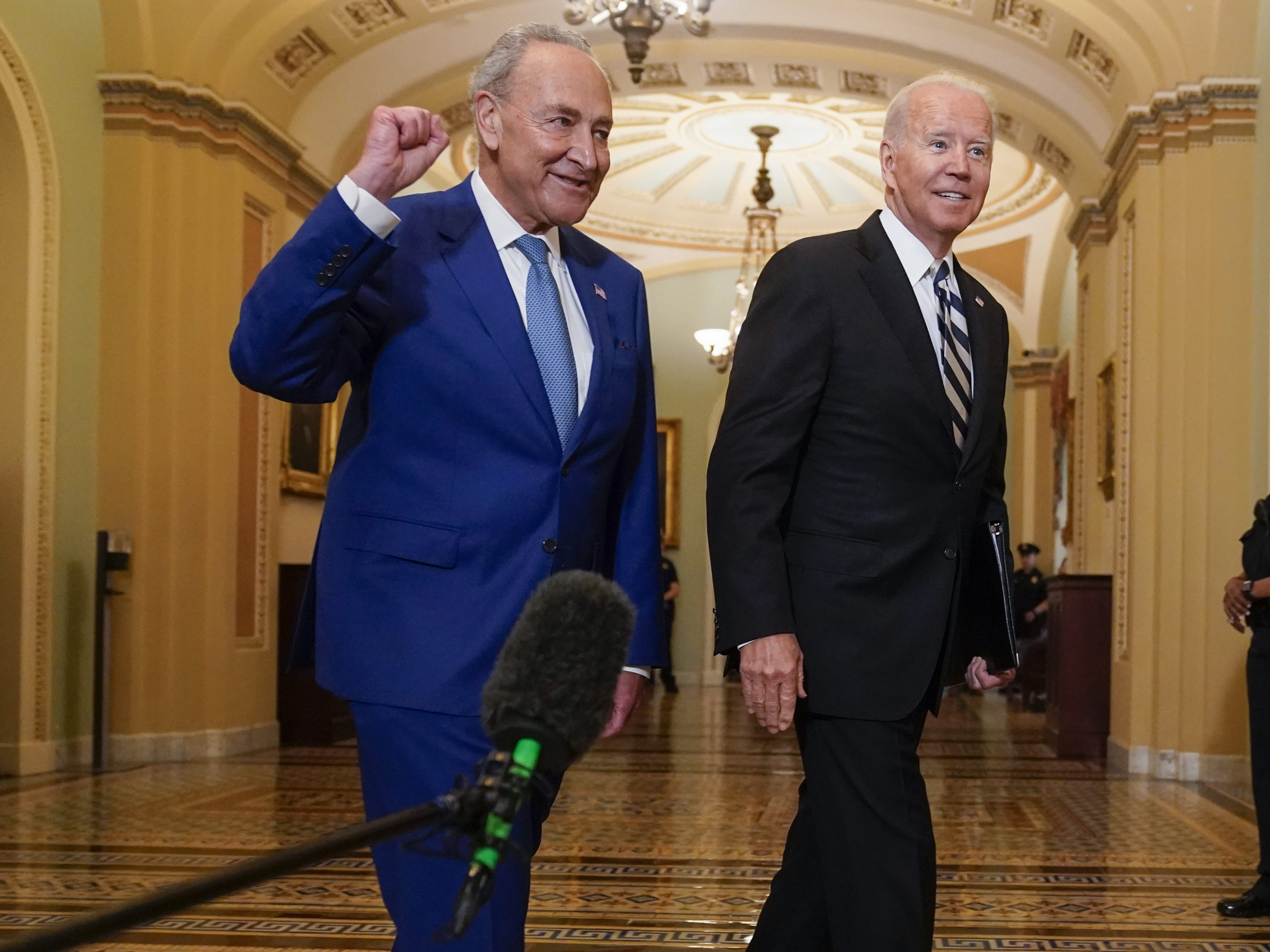 caption: President Biden meets with Senate Majority Leader Chuck Schumer last week to discuss the latest progress on his infrastructure agenda. Schumer has scheduled a key procedural vote Wednesday.