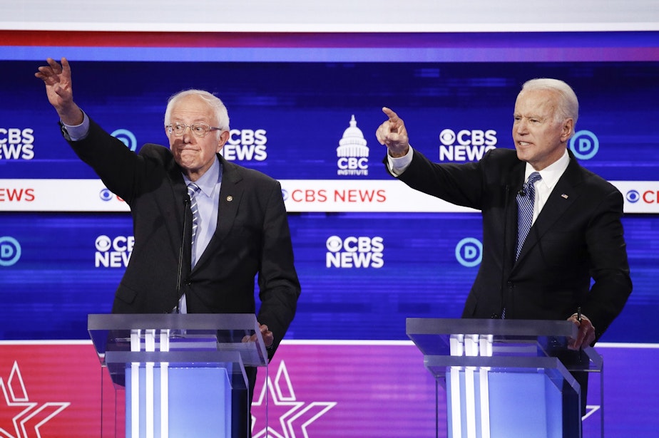 caption: Democratic presidential candidates, Sen. Bernie Sanders, I-Vt., left, and former Vice President Joe Biden, right, participate in a Democratic presidential primary debate at the Gaillard Center, Tuesday, Feb. 25, 2020, in Charleston, S.C., co-hosted by CBS News and the Congressional Black Caucus Institute.