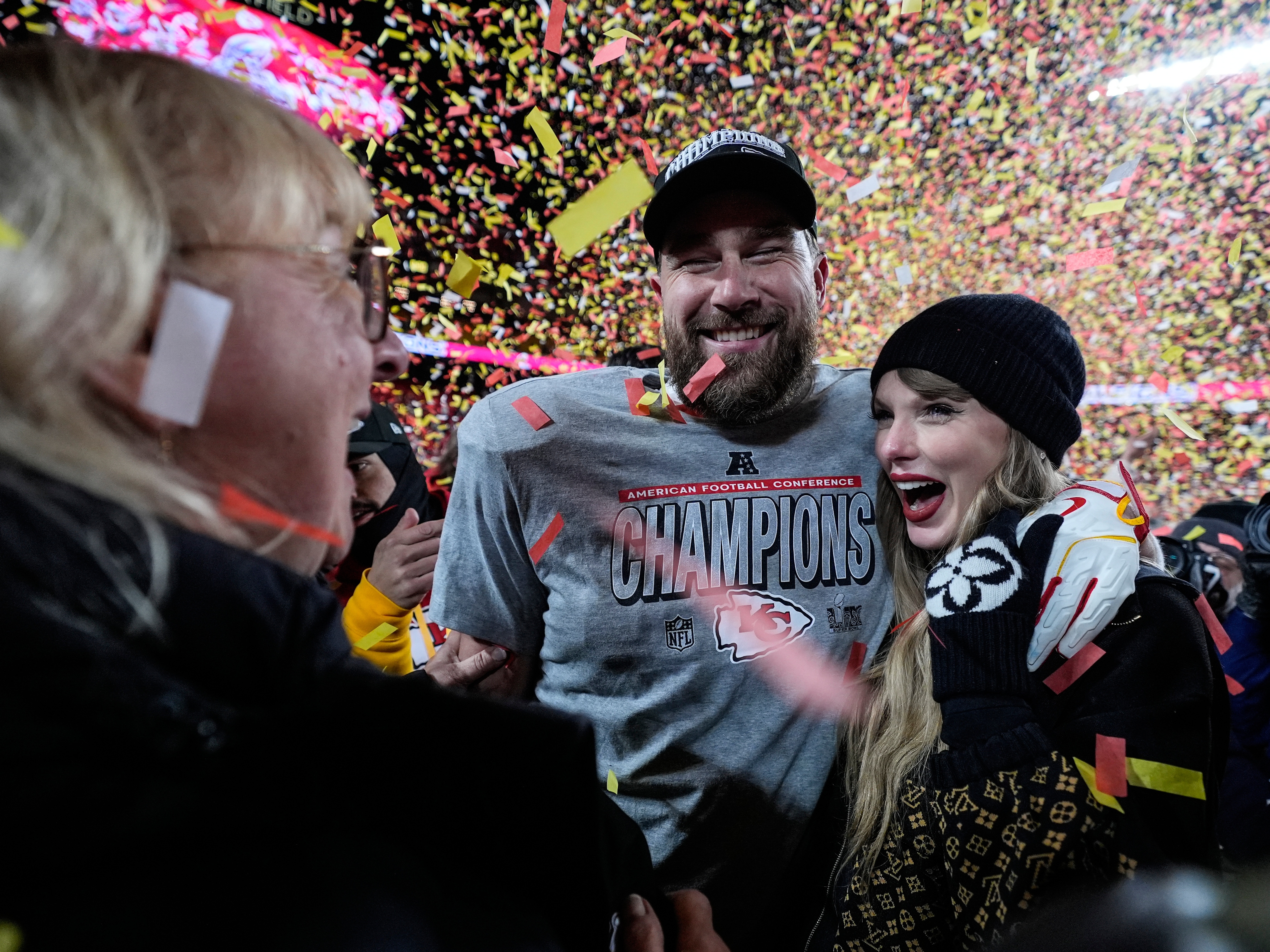 caption: Donna Kelce stands with her son Kansas City Chiefs tight end Travis Kelce and Taylor Swift after the AFC Championship NFL football game against the Buffalo Bills on Jan. 26 in Kansas City, Mo.