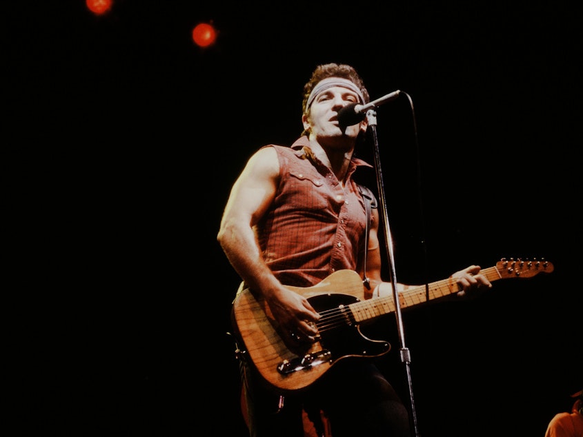 caption: Bruce Springsteen onstage during the Born in the U.S.A. Tour in 1984.