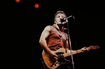 caption: Bruce Springsteen onstage during the Born in the U.S.A. Tour in 1984.