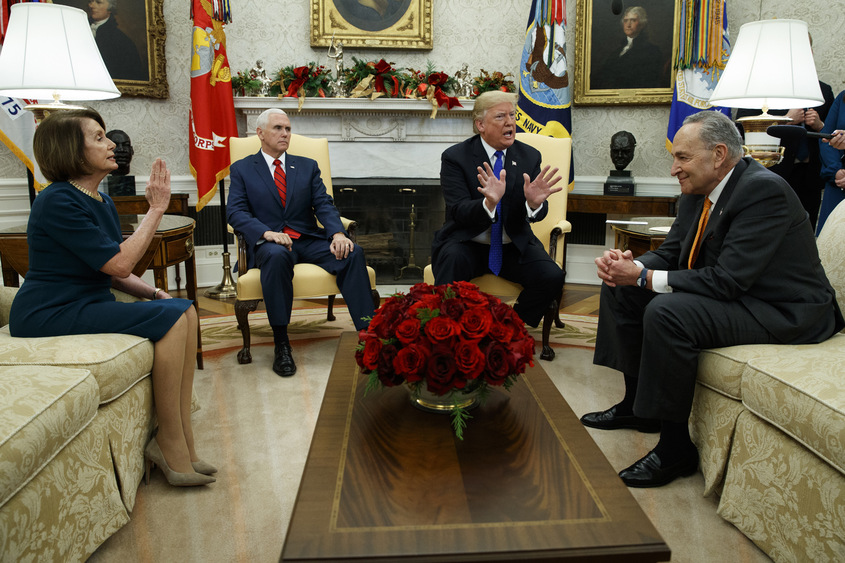 caption: House Minority Leader Rep. Nancy Pelosi, D-Calif., Vice President Mike Pence, President Donald Trump, and Senate Minority Leader Chuck Schumer, D-N.Y., argue during a meeting in the Oval Office of the White House, Tuesday, Dec. 11, 2018, in Washington. (Evan Vucci/AP)