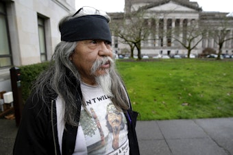 caption: Rick Williams, brother of John T. Williams, who was shot and killed by a Seattle Police officer in 2010, after he testified at a House committee hearing in Olympia, Wash. in 2016, for a bill that would make it easier to charge police officers with crimes.