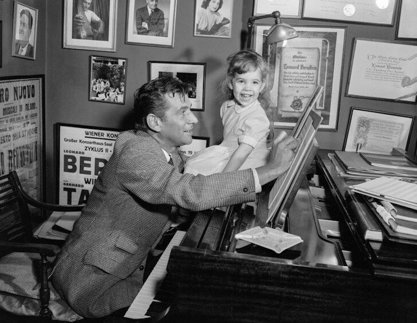 caption: Jamie Bernstein with father Leonard at work.
