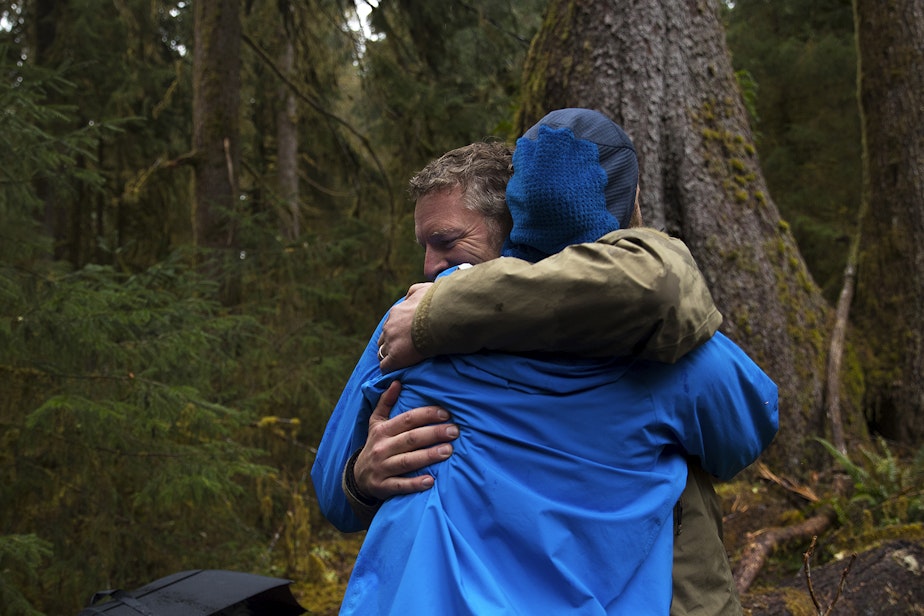 caption: Chris Morgan hugs Matt Mikkelsen after emerging from One Square Inch of Silence on Friday, April 5, 2019, in the Hoh Rainforest on the Olympic Peninsula. 