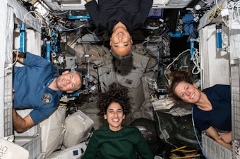 caption: The four members of NASA's Crew-7 mission pose for a portrait inside their crew quarters on the International Space Station. Clockwise from bottom are, astronauts Jasmin Moghbeli, Andreas Mogensen, Satoshi Furukawa, and Loral O'Hara. The SpaceX Crew Dragon capsule splashed down at 5:48 a.m. ET on Tuesday, March 12, 2024 to end a six-month mission.