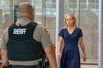 caption: Amanda Zurawski is the lead plaintiff in a lawsuit filed by the Center for Reproductive Rights against Texas. Here, she arrives at the Austin courthouse where a hearing was held on July 20.