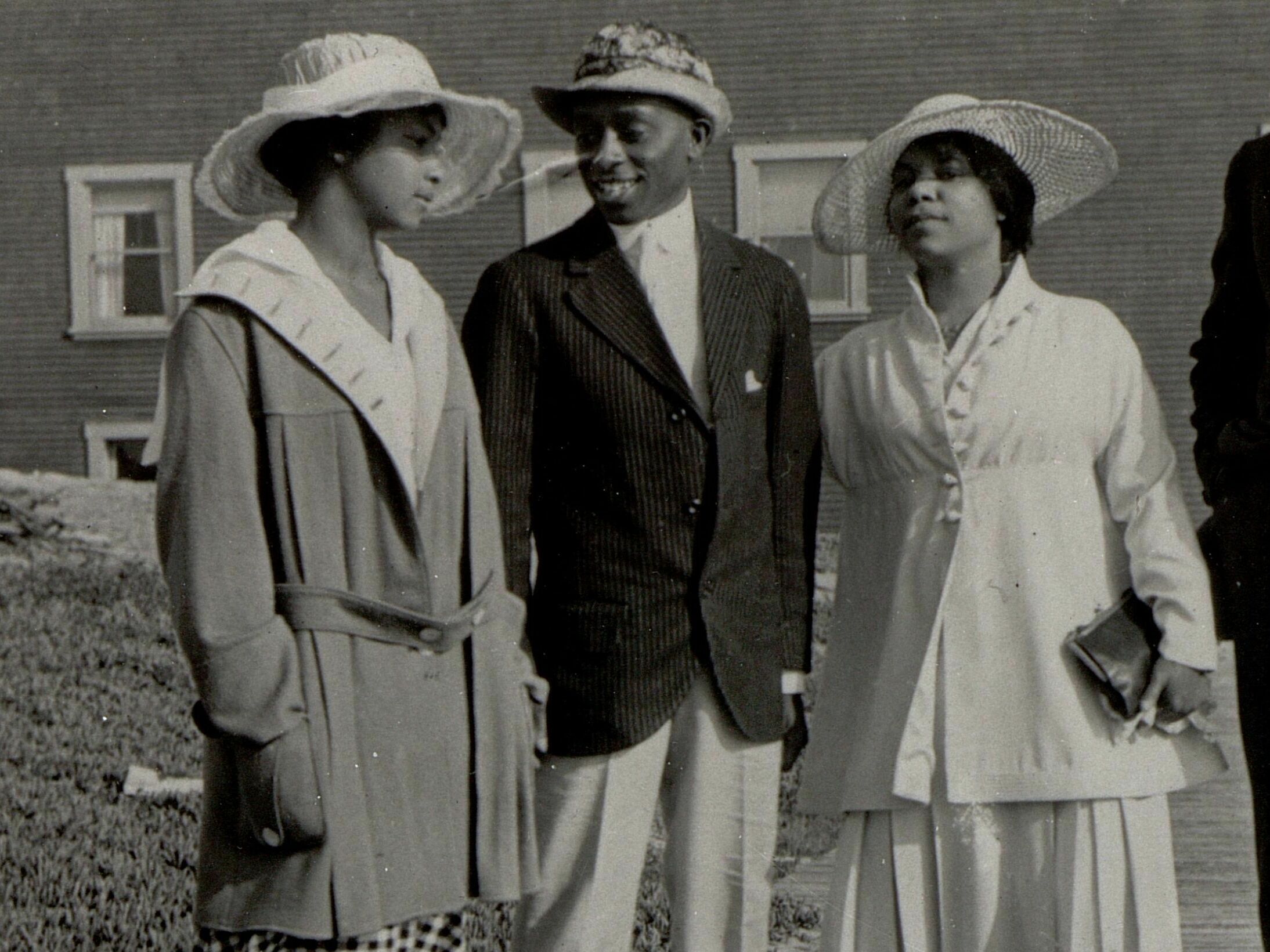 caption: Two couples stand on a walkway at the Bruce's Beach resort in Manhattan Beach, Calif., circa 1920. A few years later, the city condemned the property and seized it from its Black owners.