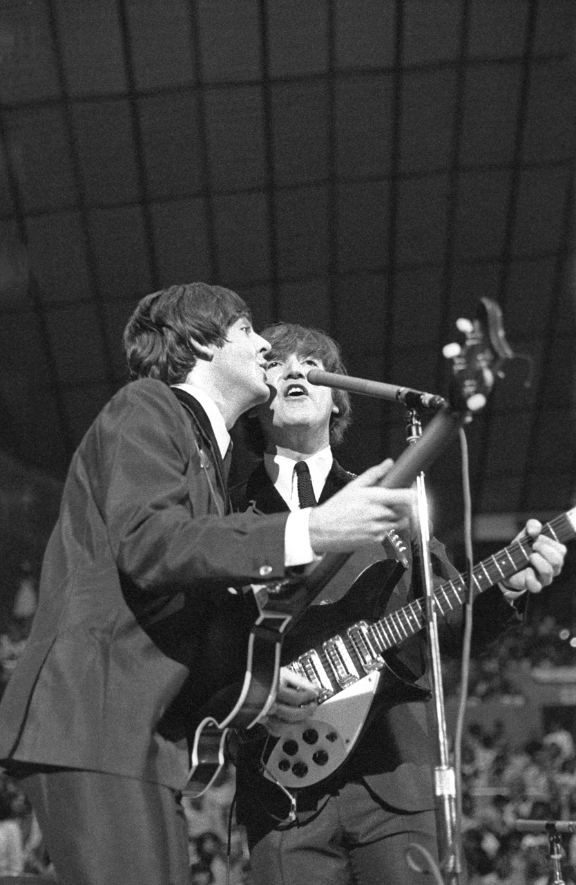 caption: Paul McCartney and John Lennon at Seattle Center Coliseum, Aug. 21, 1964