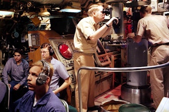 caption: The crew of an unidentified 'sturgeon class' submarine like the U.S.S. Parche, in 1980