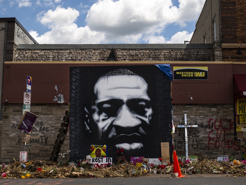 caption: A mural honors George Floyd at the intersection of 38th St. and Chicago Ave., where he was killed by Minneapolis police on May 25, inspiring protests and police reform efforts.