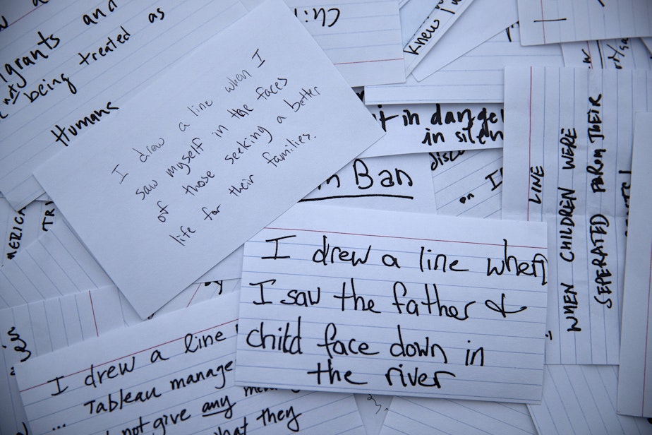 caption: Notecards handwritten by Tableau employees from a recent rally at Gas Works Park reveal what personally motivated them to 'draw a line', are shown on Wednesday, December 4, 2019, in Seattle.