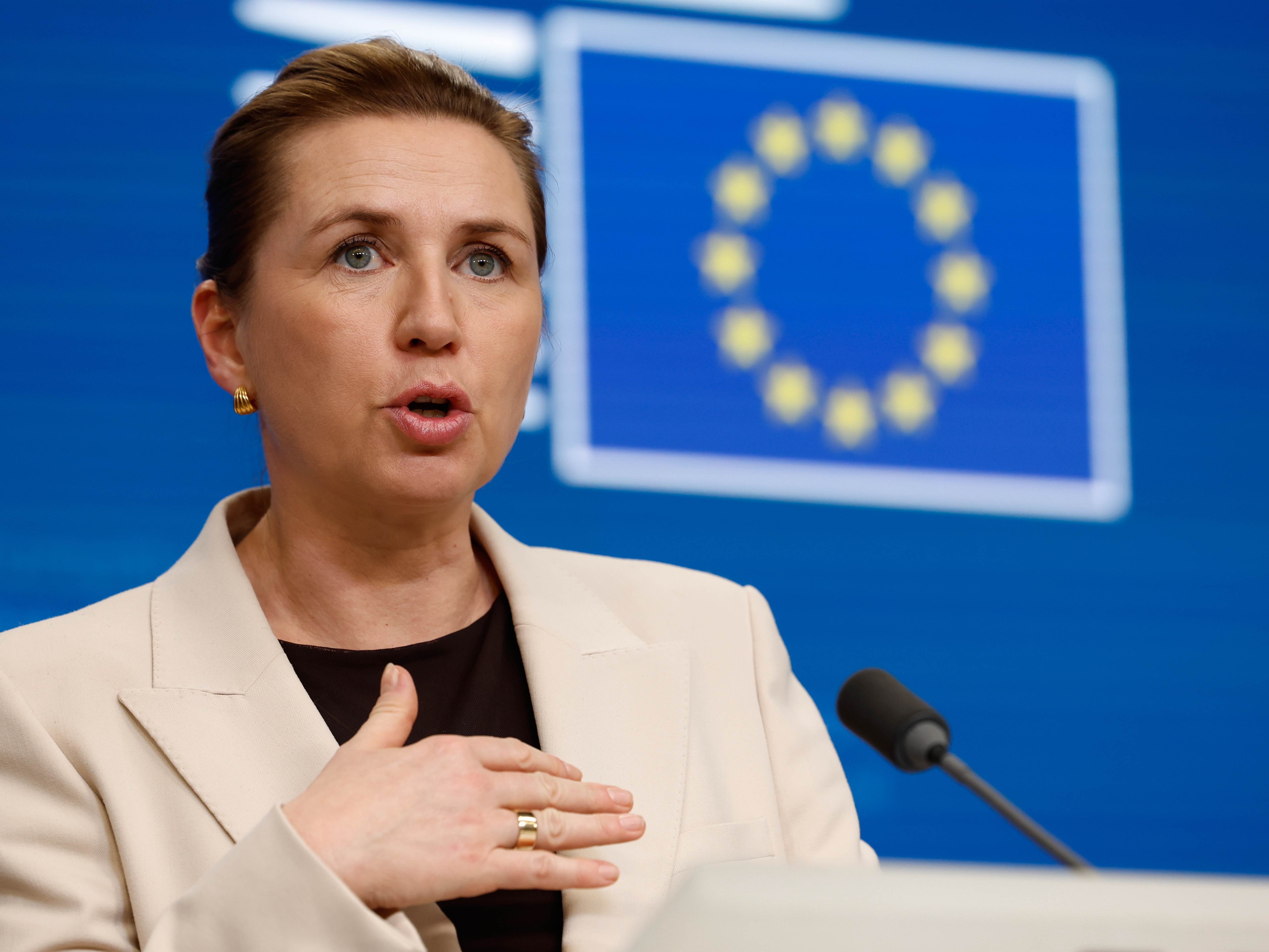 caption: Denmark's Prime Minister Mette Frederiksen speaks during a media conference at the EU Summit in Brussels, Friday, Dec. 19, 2025.