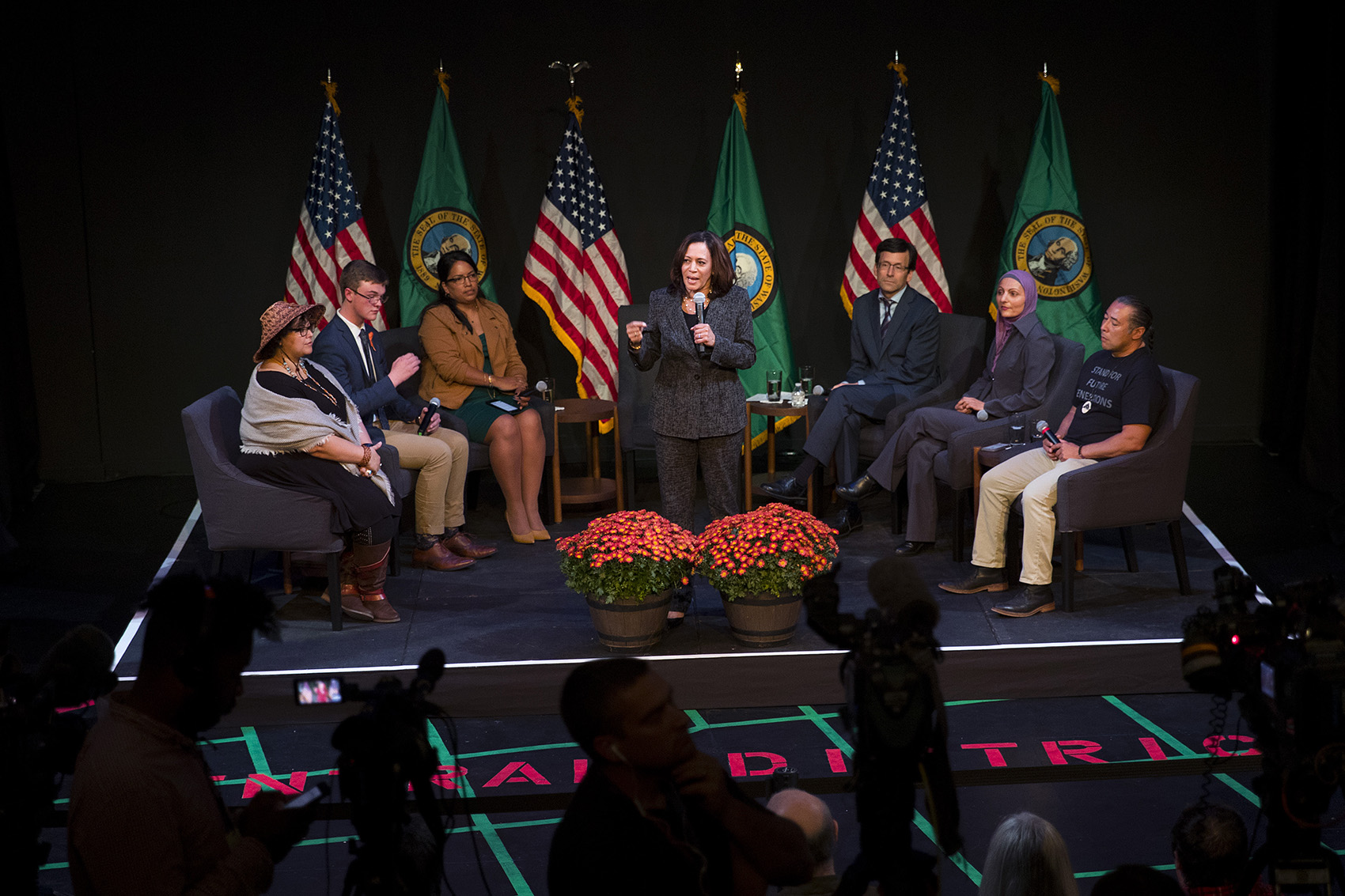 caption: Senator and Presidential candidate Kamala Harris speaks to the audience during a gun safety roundtable on Friday, September 27, 2019, at Langston Hughes Performing Arts Institute in Seattle.