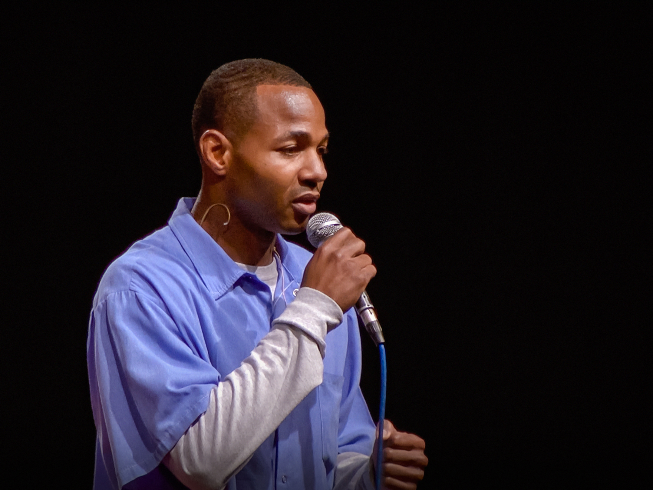 caption: Curtis Carroll on the TED stage.
