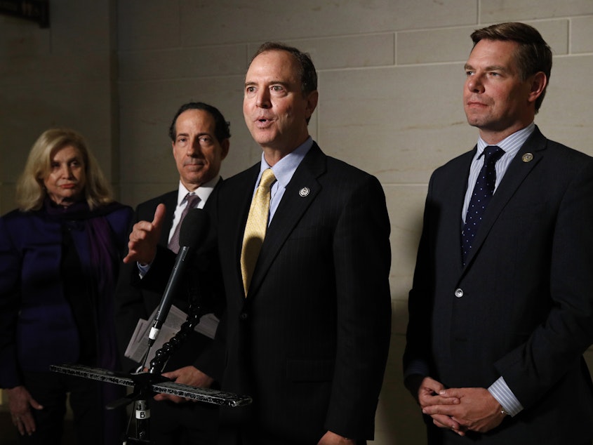 caption: Rep. Adam Schiff (center) chairs the House Intelligence Committee, which would conduct any open hearings under the House impeachment inquiry, according to procedures specified in a resolution formalizing the process.