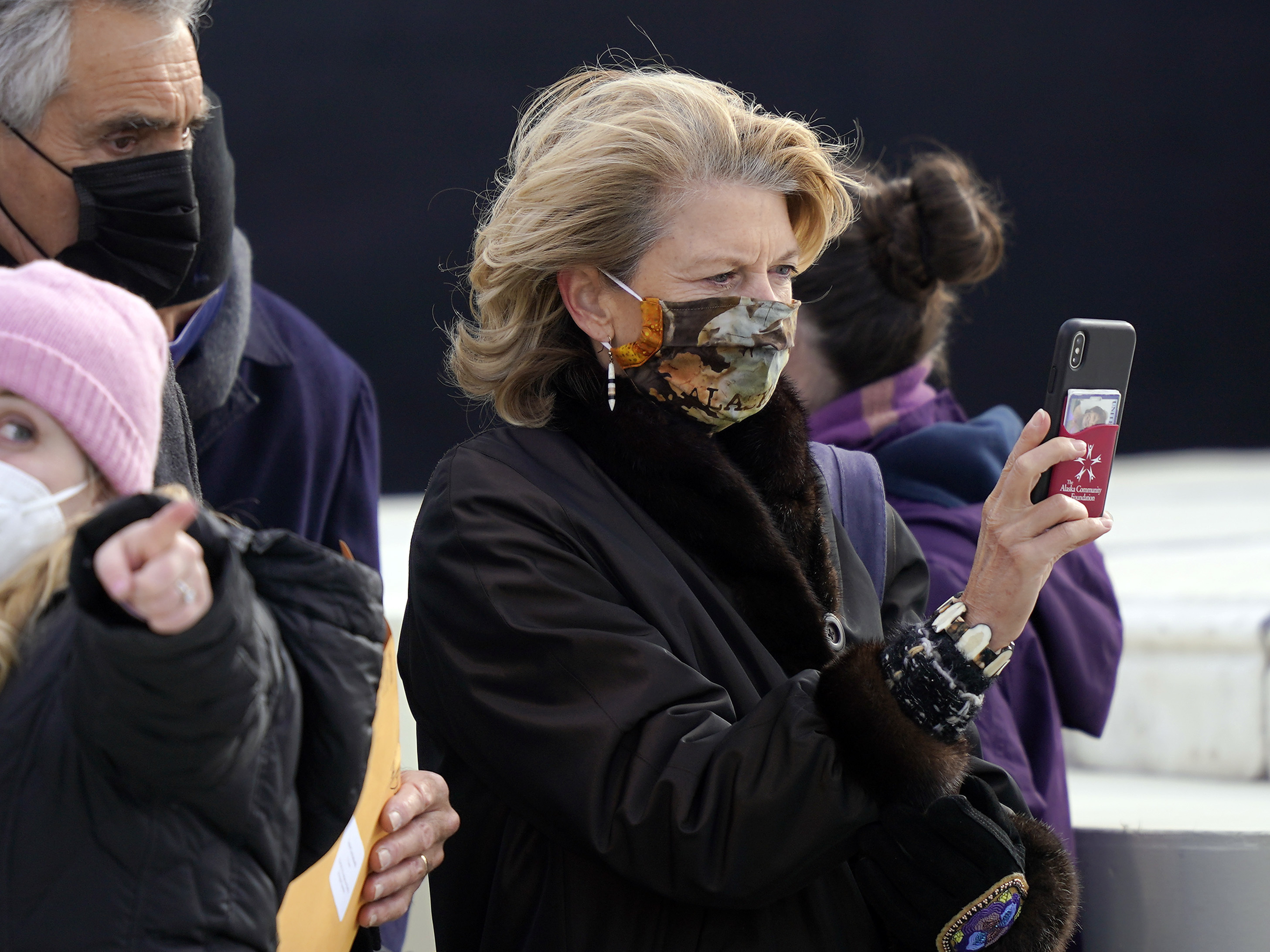 caption: Sen. Lisa Murkowski, R-Alaska, arrives Wednesday at the U.S. Capitol for the inauguration of President Biden.