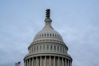 caption: The Senate has approved a short-term spending bill to extend government funding into early next year.