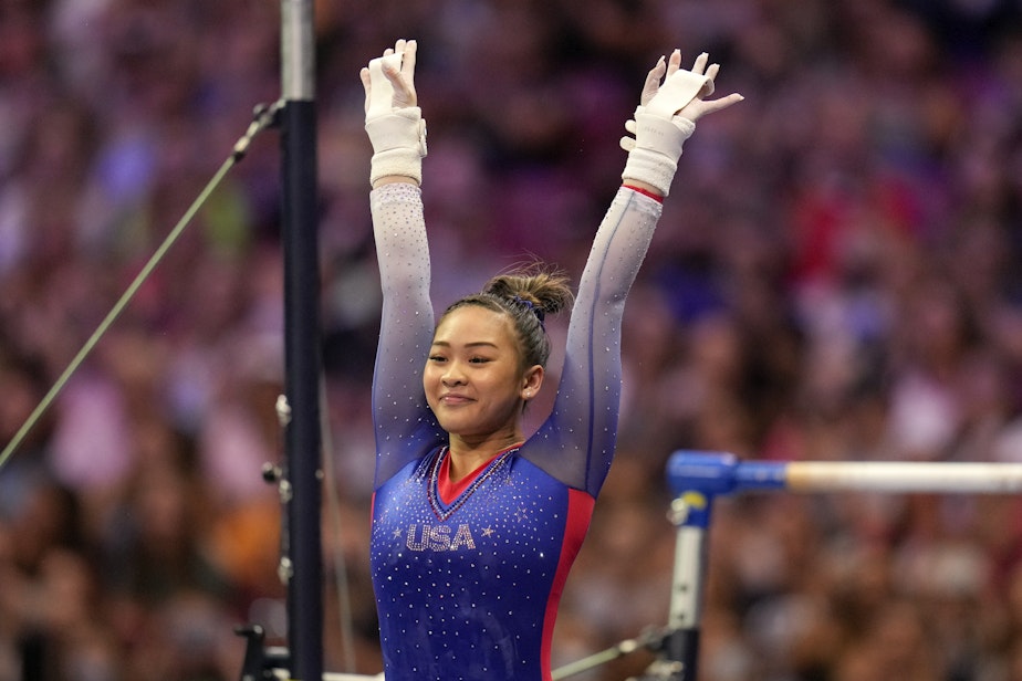 caption: Suni Lee reacts to her performance on the uneven bars during the women's U.S. Olympic Gymnastics Trials Friday, June 25, 2021, in St. Louis.
