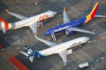 caption: Grounded Gol Airlines, Southwest Airlines and Alaska Airlines Boeing 737 Max aircraft at Boeing facilities in Moses Lake, Wash., last month