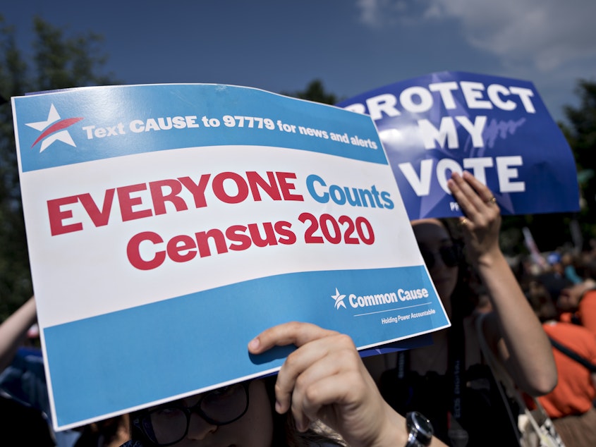 caption: A demonstrator holds a sign about the U.S. census outside the Supreme Court in Washington, D.C., in 2019. The Census Bureau has stopped all work on President Trump's directive to produce a count of unauthorized immigrants that could be subtracted from a key set of census numbers, NPR has learned.