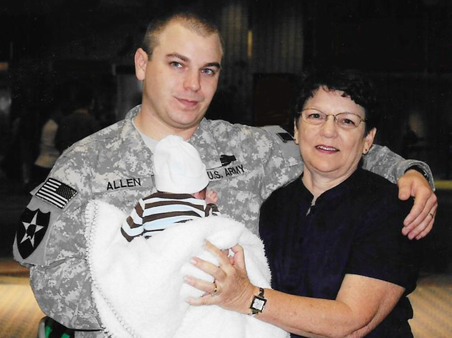 caption: Cathy Sprigg with her son, Army Spc. Robert Joseph Allen, at Tampa International Airport in 2010. At the time, Allen was headed back to Iraq after being on leave for the birth of his son.