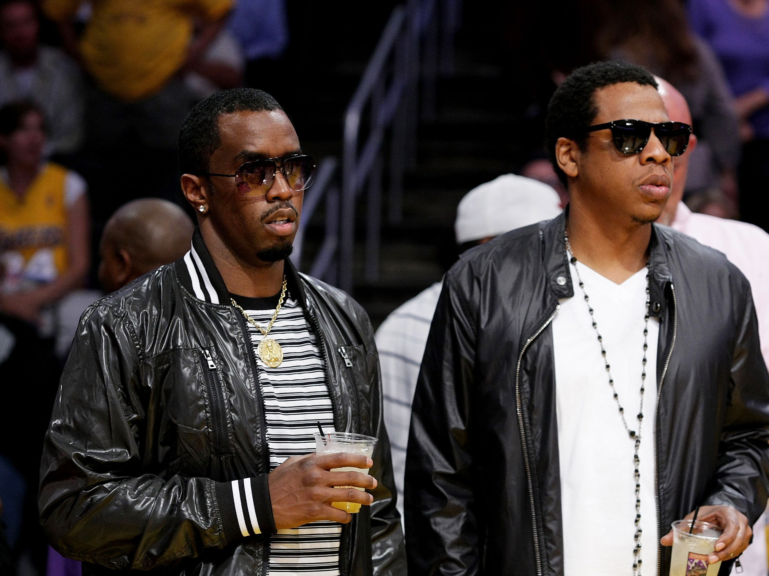 caption: Sean Combs (left) and Jay-Z attend the Los Angeles Lakers vs. Houston Rockets game at Staples Center on May 4, 2009, in Los Angeles.