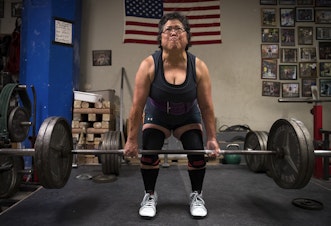 caption: Alma Kimura, 63, powerlifts at Seattle Strength and Power on 3rd Ave., in Seattle. Kimura started powerlifting at age 58. 