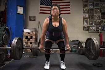 caption: Alma Kimura, 63, powerlifts at Seattle Strength and Power on 3rd Ave., in Seattle. Kimura started powerlifting at age 58. 