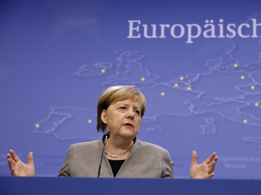 caption: German Chancellor Angela Merkel speaks during a news conference at the conclusion of a European Union summit in Brussels, Dec. 13.