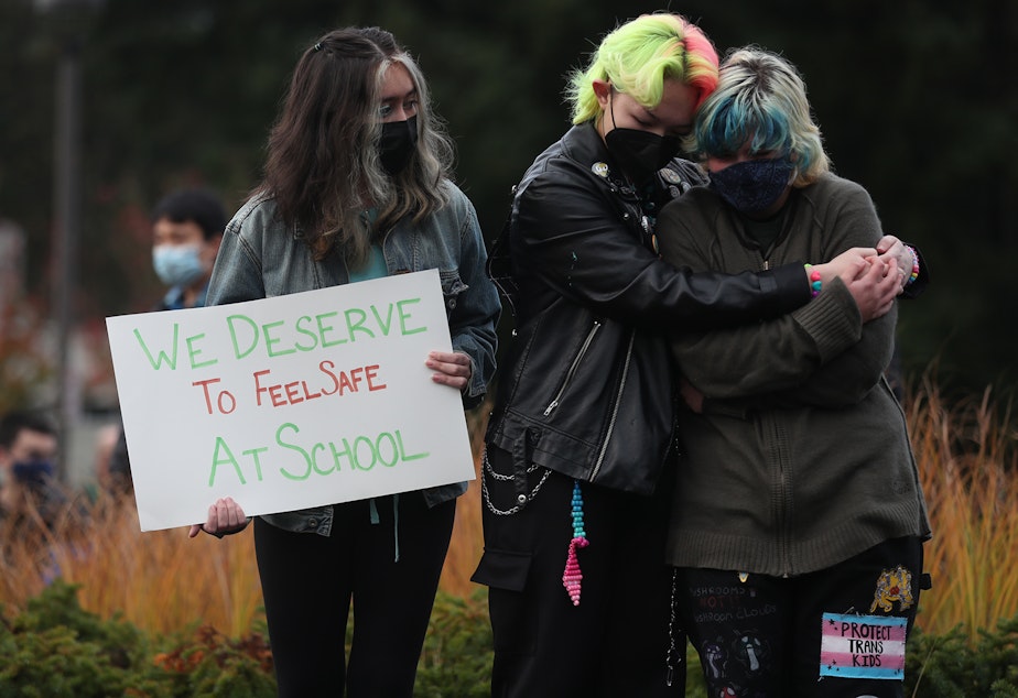 caption: Interlake High School students comfort each other during a protest in response to the school's handling of cases of sexual assault, on Tuesday, November 23, 2021, at Interlake High School in Bellevue. 