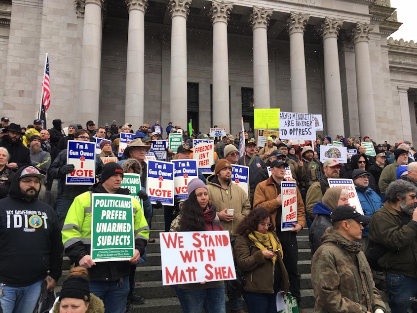 caption: Gun rights supporters rally on the steps of the Washington state Capitol on Friday. Among the speakers was Republican state Rep. Matt Shea who participated in an act of domestic terrorism, according to a recent House investigation.