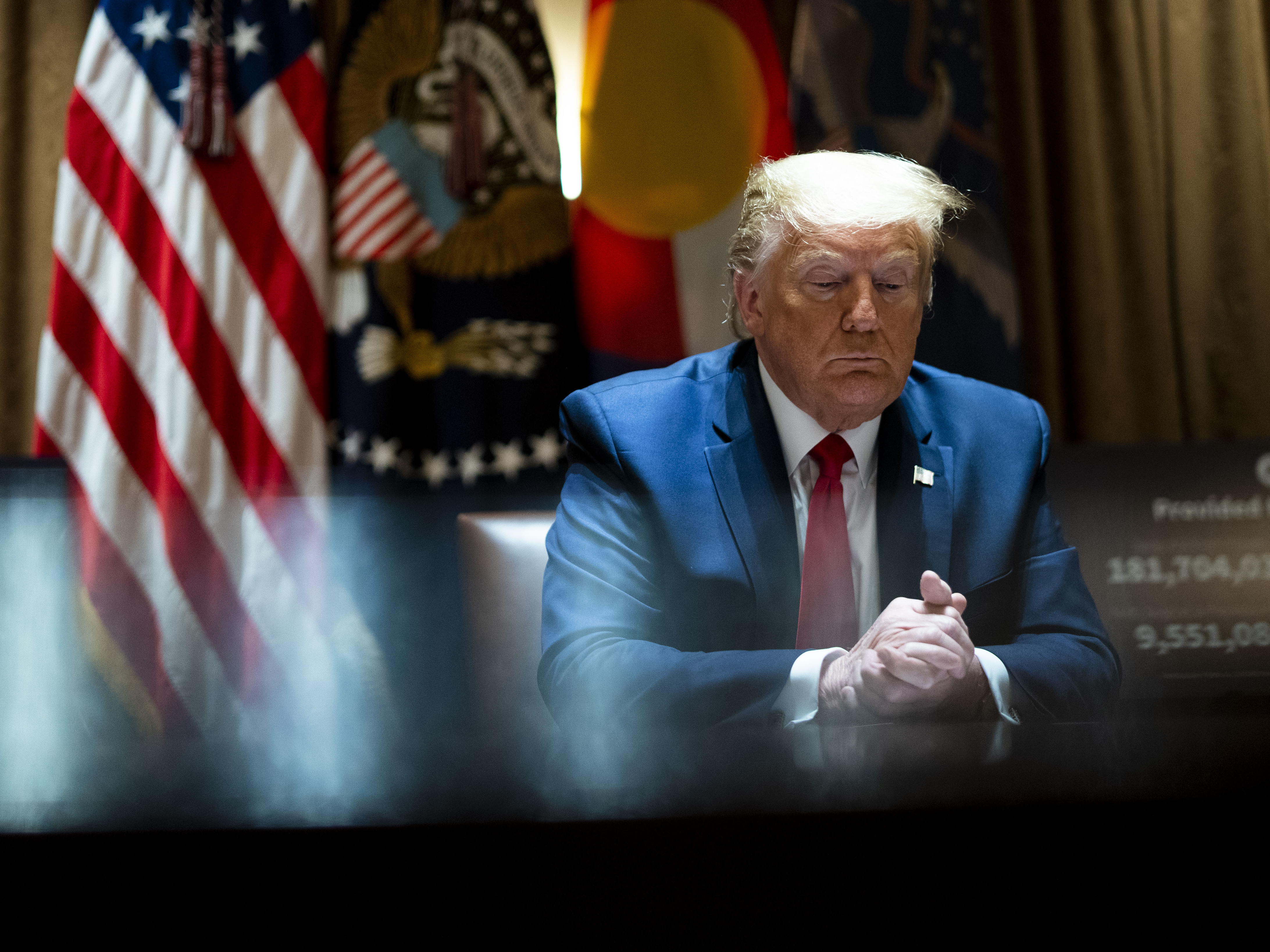 caption: President Trump meets with Colorado Gov. Jared Polis and North Dakota Gov. Doug Burgum in the White House Cabinet Room.