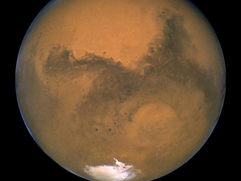 caption: A close-up of Mars taken by NASA's Hubble Space Telescope. New research suggests that the red planet may be too small to have ever had large amounts of surface water.