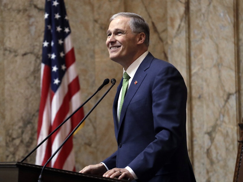 caption: Washington Gov. Jay Inslee gives his State of the State address to a joint session of the Legislature on Jan. 15, 2019, in Olympia, Wash.