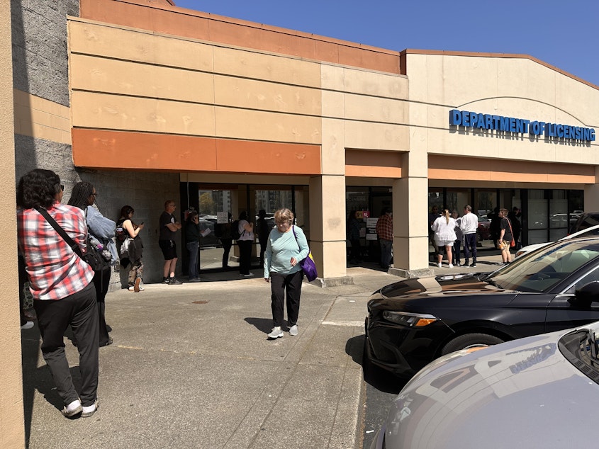 caption: A long line formed outside the Shoreline office of the Washington Department of Licensing on Wednesday, April 23, two weeks before the federal REAL ID law is set to take effect.