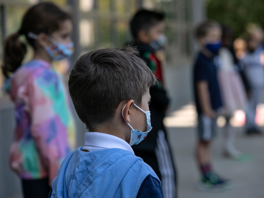 caption: The White House says it is planning to distribute masks for children. The announcement comes as many states have been dropping mask requirements for schoolchildren.