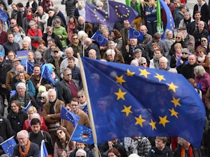 caption: Pro-European Union demonstrators march in Berlin on March 31.
