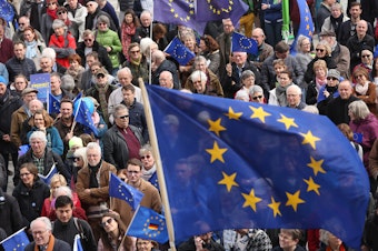 caption: Pro-European Union demonstrators march in Berlin on March 31.