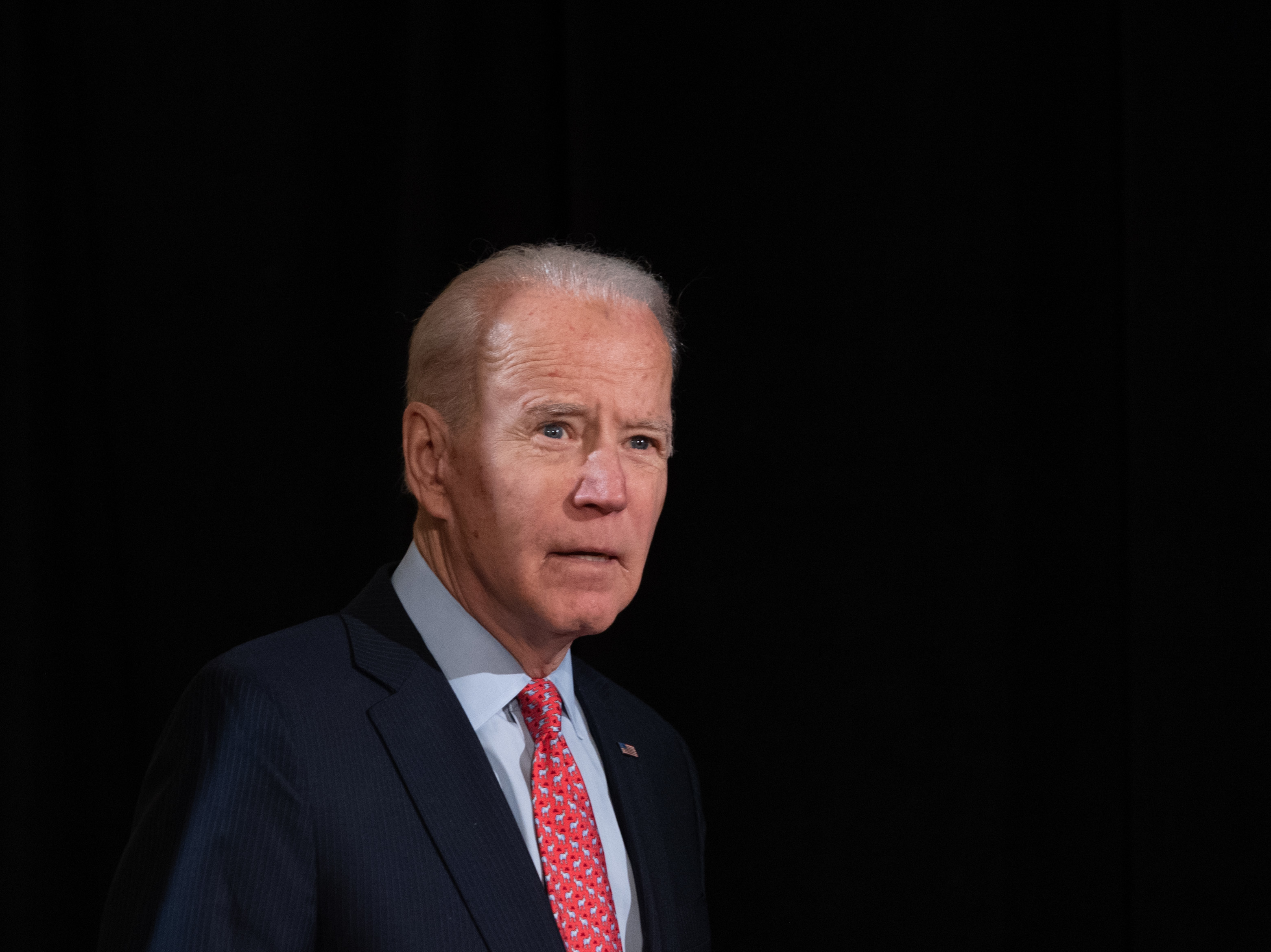 caption: Former vice president and Democratic presidential hopeful Joe Biden, seen arriving to give a speech about the coronavirus response on March 12, spoke with President Trump about the crisis on Monday.