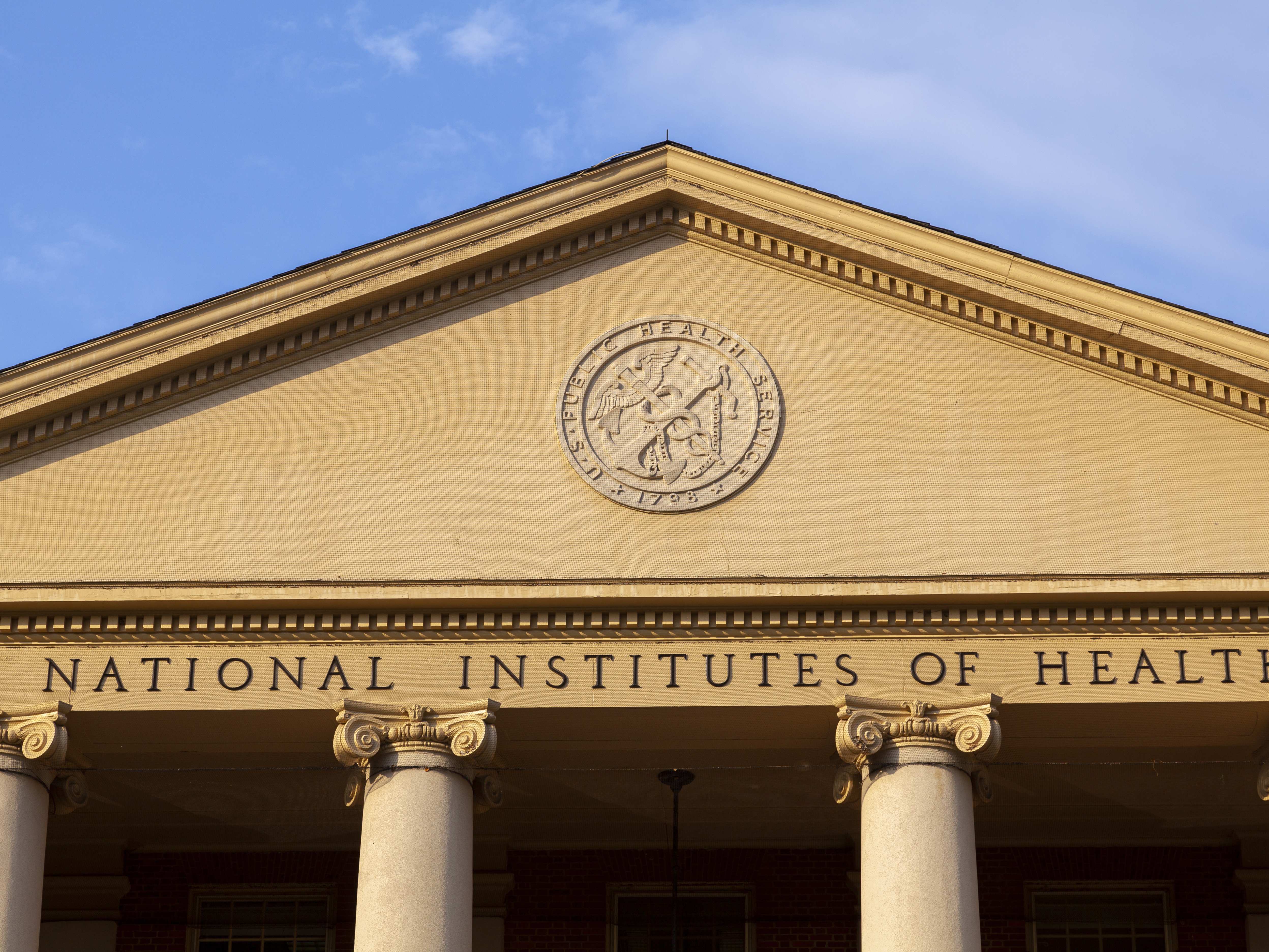 caption: The historic main building of the National Institutes of Health in Bethesda, Maryland.