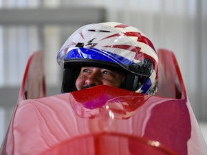 caption: Will Castillo, 42, looks to his U.S. Para Bobsled teammates before taking a trial run at the Para Bobsleigh World Cup at Mount Van Hoevenberg in Lake Placid, N.Y.