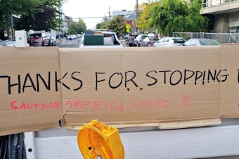 caption: A sign at the exit of Capitol Hill's occupied protest zone.
