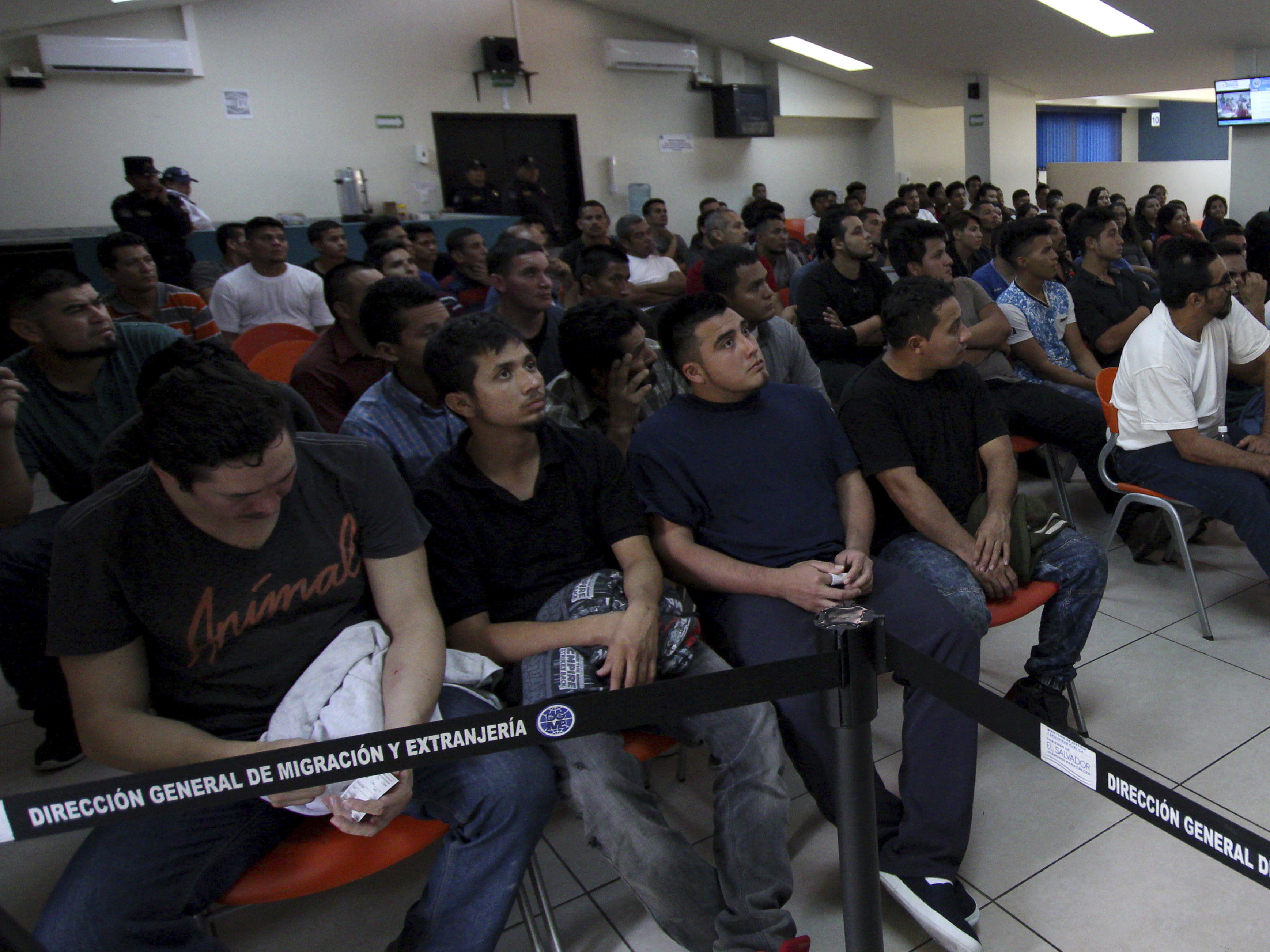 caption: Salvadoran deportees, pictured in June 2018, listen to instructions from an immigration officer at La Chacra Immigration Center in San Salvador, El Salvador. A Human Rights Watch Report found that 138 repatriated Salvadorans have been killed since 2013. More than 70 others were beaten, sexually assaulted, extorted, tortured or went missing.