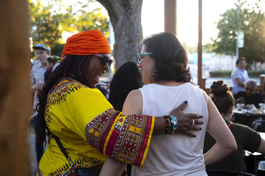 caption: Supporter Afua Kouyate, left, greets Seattle City Council incumbent Tammy Morales, representing District 2, during a primary election night gathering on Tuesday, August 1, 2023, at Taco City Taqueria along Rainier Avenue South in Seattle.