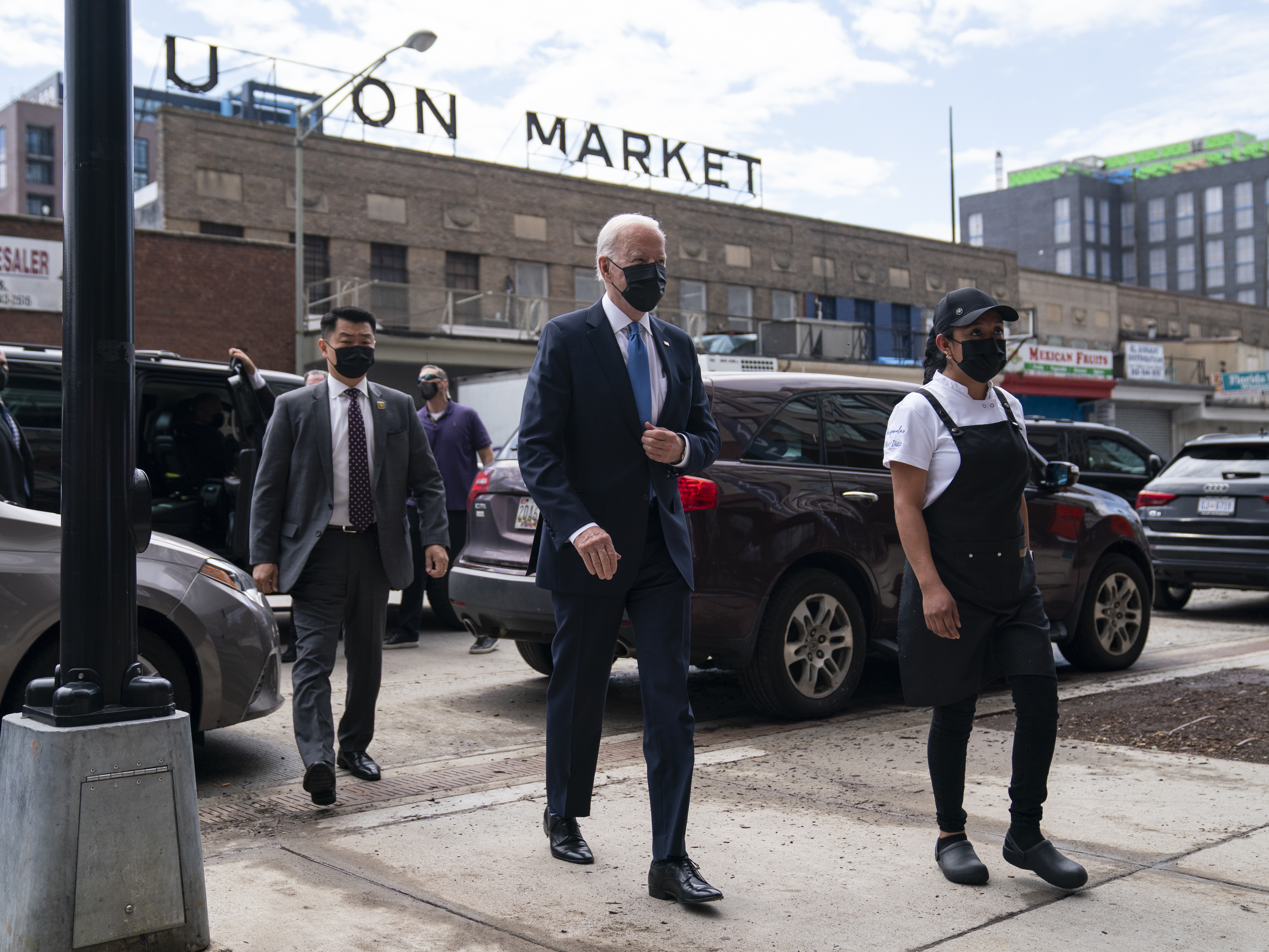 caption: President Biden arrives for a visit to Taqueria Las Gemelas restaurant in Washington as part of the opening of the Restaurant Revitalization Fund, an coronavirus relief effort that opened this week.