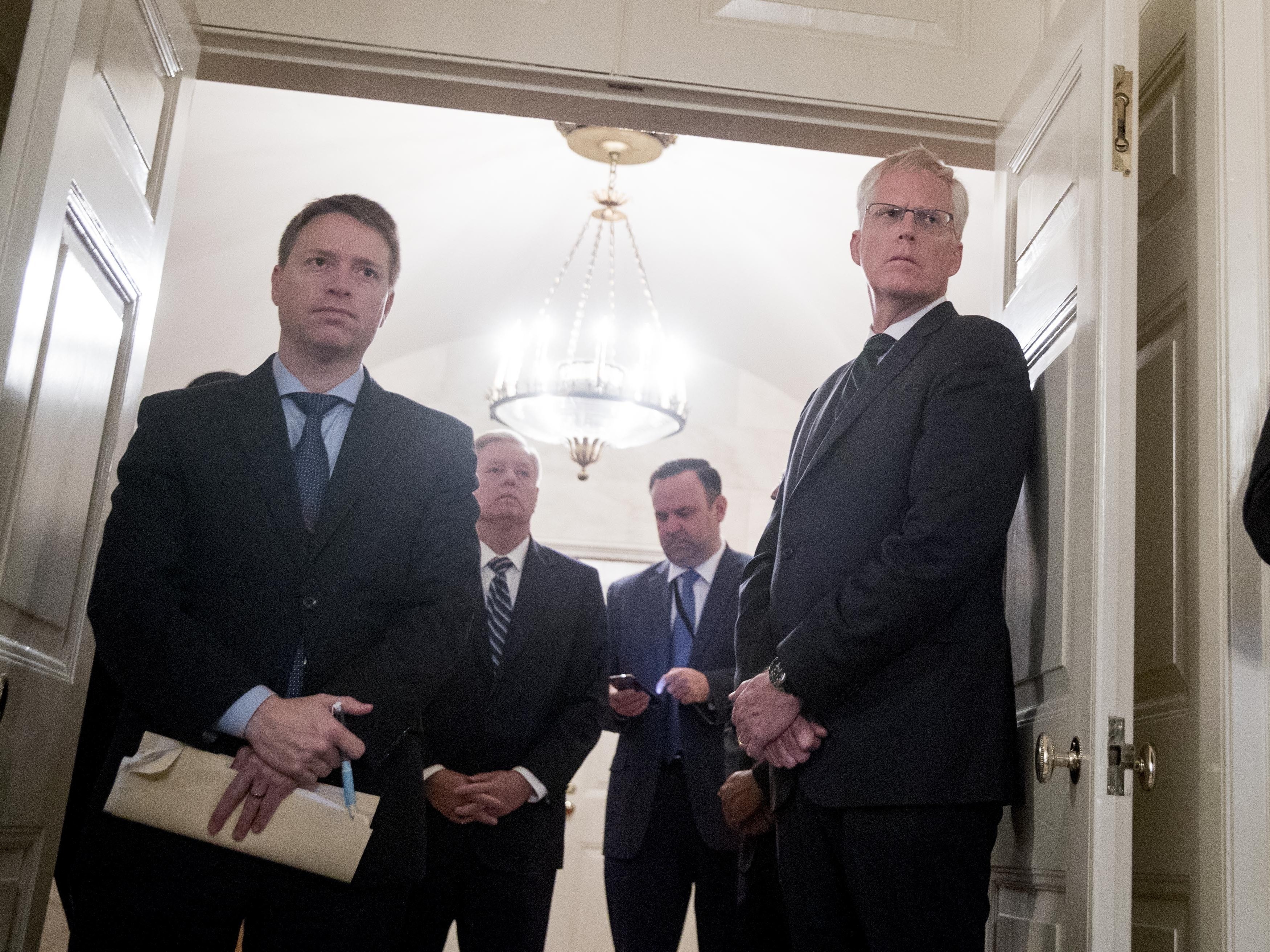 caption: Matt Pottinger, Trump's deputy national security adviser (left), at a White House event last year. Pottinger delivered a speech on Monday in Mandarin aimed at a Chinese audience.