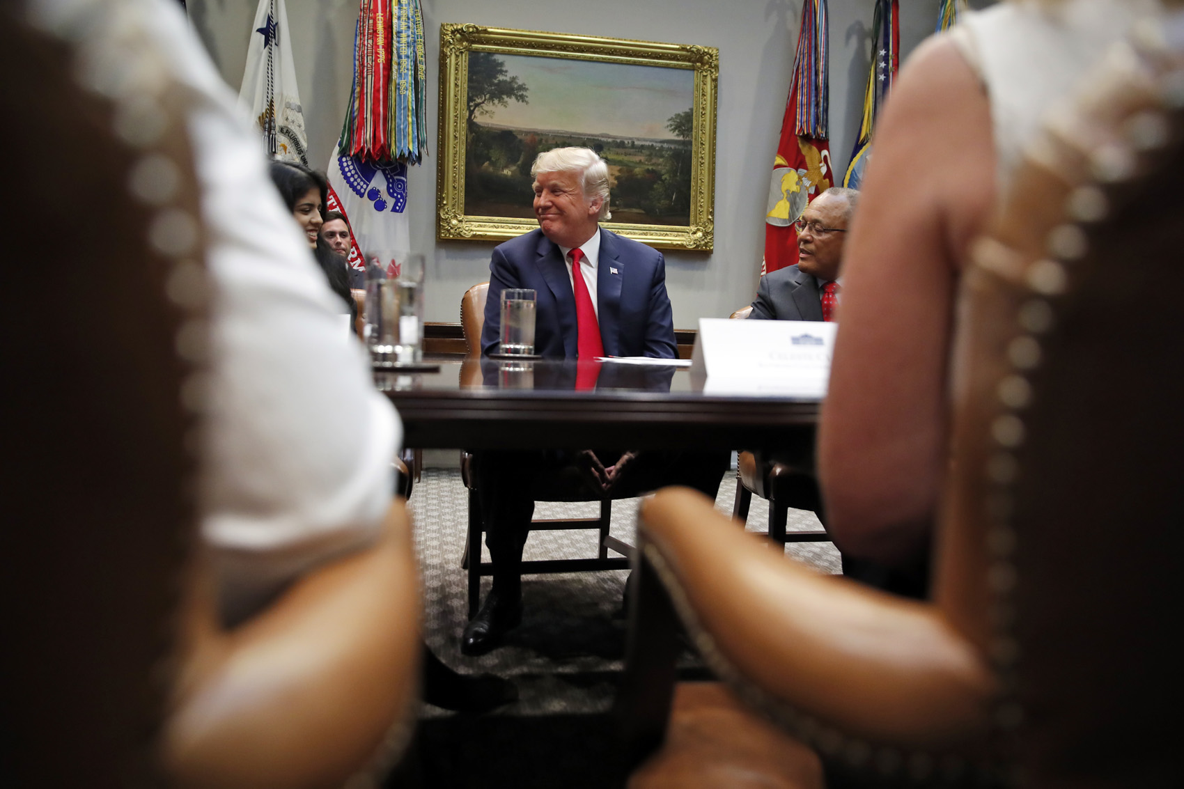 caption: President Donald Trump smiles during a discussion for drug-free communities support programs, in the Roosevelt Room of the White House, Wednesday, Aug. 29, 2018, in Washington. (Alex Brandon/AP)