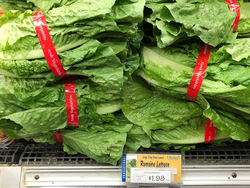 caption: Romaine lettuce is displayed on a shelf at a supermarket in California in April, during an <em>E. coli</em> outbreak traced to contaminated lettuce. The CDC says a new outbreak has made lettuce dangerous to eat, just in time for America's most foodcentric holiday.
