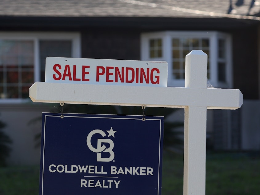 caption: A "sale pending" sign is posted in front of a home for sale on November 30, 2023 in San Anselmo, Calif.  Realtors face lower commissions after a major settlement upended the way  Americans buy and sell homes.